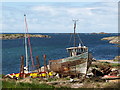 Old fishing boat under repair in PA47 7SP