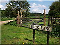 Gate and road name sign, Back Lane, Long Compton in CV36 5LG