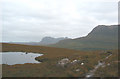 Lochan Fhionnlaidh, with Suilven and Cul Mor behind in IV26 2XY