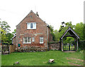 Cottage beside the lych gate in Rougham in PE32 2SE