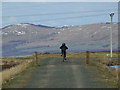 Young cyclist on The Waterman's Road in PA16 9NP