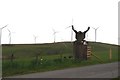 Minsca gate entrance with Wind Farm in background in DG11 3EX