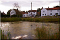 Pond and Cottages, Edgefield, Norfolk in Edgefield