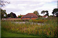 Pond and Village Hall, Edgefield, Norfolk in Edgefield