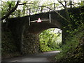 Disused railway bridge, at Leigh Cross in EX6 7LA