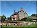 Flint and brick cottage in Horningtoft in Horningtoft