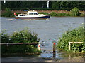 River Thames with boat, at high tide in W4 2SH