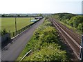 Road and railway from the footbridge in Widdrington Station and Stobswood