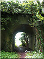 Path under disused railway bridge in PE32 2DJ