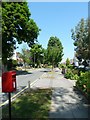 Looking towards a traffic island in Lynwood Avenue in BR6 0DP