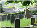 Churchyard of Llanwnog parish church, Powys in SY17 5JG