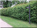 Footpath sign next to Holy Trinity Church, Bradwell in Bradwell