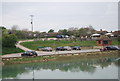 Cars parked by the River Cuckmere in BN25 4AB