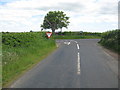 Junction of A697 and minor road near Springwells in TD10 6UL