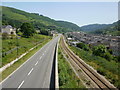 Road and rail viewed from Cwm footbridge in NP23 7SU