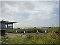 Dartford Flood Barrier against the foreground of the Rainham Marshes Information Centre in RM19 1ZU