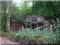 Derelict railway wagons, Cwm Farm, formerly used as farm buildings in CF83 1SP