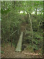 Unused footbridge in Tickner's Wood in TN8 7HN
