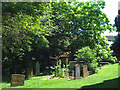 Memorials and trees, St Mary's churchyard in CV34 6AU