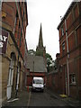 St. John's church seen down an alleyway off Aire Street, Goole in DN14 6SW
