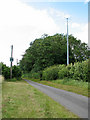 Transformer and mast beside rural lane in PE32 2BT