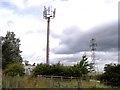 Telecommunications mast and pylon straddle the M58 near Lawns Farm in WN8 0BN