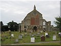 Churchyard by the west end of Binham parish church in Binham