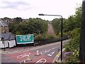Road and rail, viewed from Parkland Walk in N4 4EL