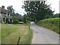 West on Church Lane approaching its junction with Hambledon Road in GU8 4HH