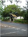 Looking from Church Lane across Church Road towards the lych gate in GU30 7FZ