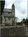 Looking from Beales Lane towards the modest spire of St Peter's, Wellington in GU10 4QP