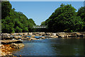 Weir and footbridge on the River Neath at Abergarwed in SA11 4DG