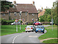 Cars passing in Mill Lane, Thetford in IP24 2EQ