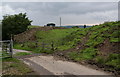 Path leaving the farm track near Clough Head in SK11 0SL