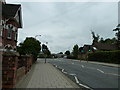 Looking along Hurst Road towards the railway station in RH12 2QL