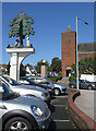 'Court Oak' pub sign & car park with church over the road in B32 2TS