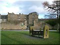 Eyam Hall and the village stocks in Eyam