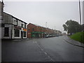 Milkstone Road, Rochdale in the rain in OL11 1QS