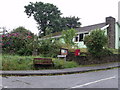 Postbox and seat on corner of Meadow Park, Treffgarne, Pembrokeshire in SA62 5PJ