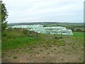 Large bales in a field in GL55 6XS