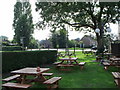 The Walnut Tree pub garden, Runcton, West Sussex in PO20 1SP