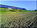 Ploughed stubble field and a train in OX10 9PS