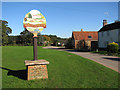 Village sign on the green, North Runcton in PE33 0RD
