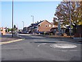 Mini roundabout and shops at Shevington in WN6 8HW