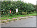 Seat, postbox and village information board in NR25 6PQ