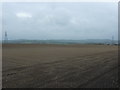 Pylons cross a field in DE5 3RR