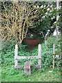 Stile in churchyard fence in NR20 5TS