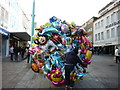 Selling balloons on a windy day in PL1 2PU