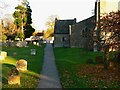 The churchyard and north porch of the Church of St Denys, Stanford in The Vale in SN7 8PG
