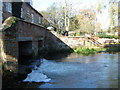 The River Wensum flowing under Sculthorpe Mill in Norfolk in NR21 9QD